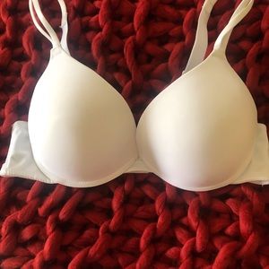 Pretty white padded bra with underwire. New without tags.